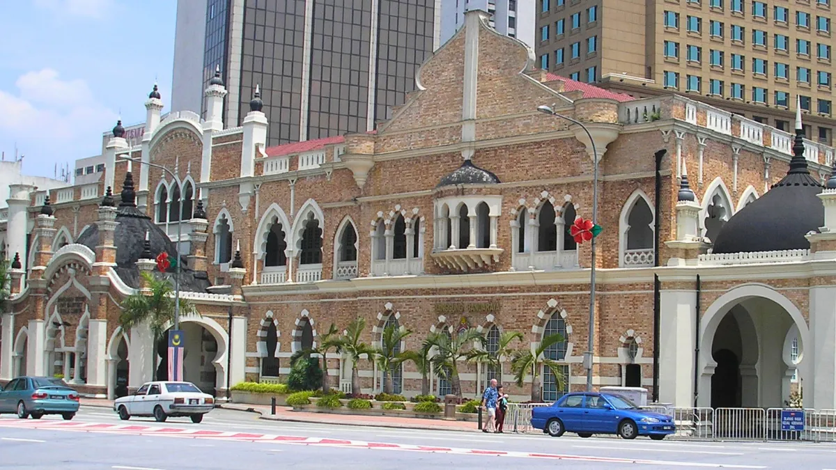 Panggung Bandaraya (City Theatre) Historic brick building with arched windows and domed towers in a city street